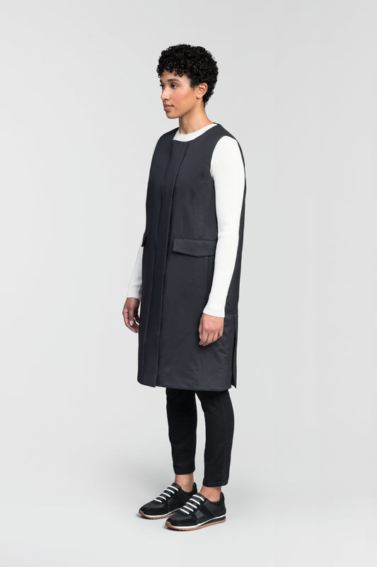 Brexton Women's Tailored Long Mid Layer Vest in knee length, centre front wind flap, flap closure waist pocket with additional side entry storage, single vent on back bottom hem, in Black