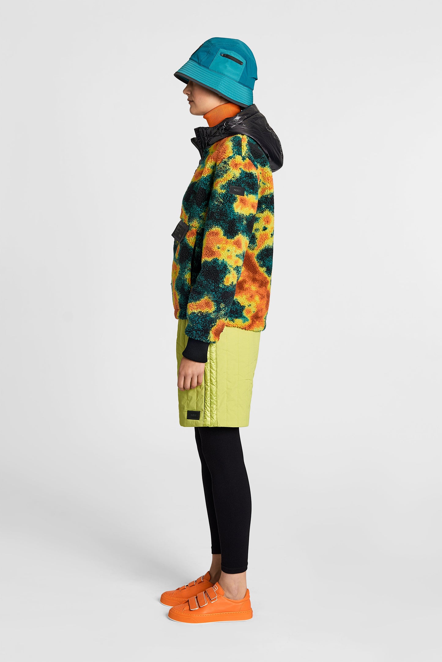 Roche Women's Hybrid Berber Pullover Hoodie in hip length, premium berber and cire technical nylon taffeta fabrication, Primaloft Gold Insulation Active+, non-removable hood with zipper at collar, kangaroo pocket with magnetic closure flap and additional side-entry pockets, ribbed cuffs, adjustable drawcords at side hem, in Heat Map