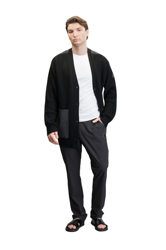 Riga Tailored Button Front Cardigan in thigh length, premium virgin extra fine merino wool knit and stretch ripstop fabrication, Primaloft Gold Insulation Active+, button-front closure, quilted back detailing, front waist pockets, in Black