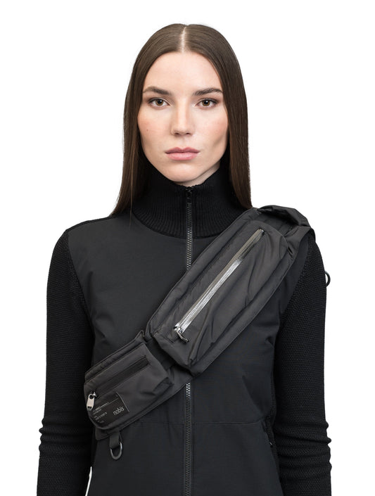 Cylar Unisex Tactical Modular Belt in 3-ply micro denier fabrication with DWR coating, cobra buckle closure with webbing straps, and three pockets with waterproof zippers, in Black + Black