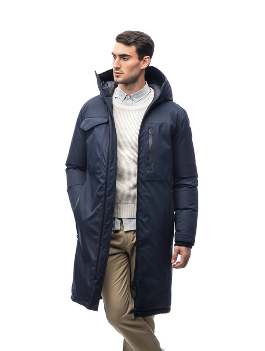 Long men's calf length parka with down fill and exposed zipper that features spacious pockets and zippered vents in Navy + Navy