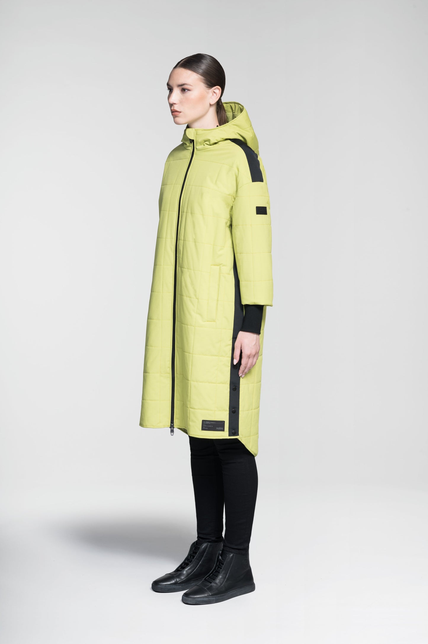 Radar Women's Performance Long Midlayer Jacket in long length, premium stretch ripstop and stretch Toray nylon fabrication, premium 4-way stretch, water resistant Primaloft Gold Insulation Active+, non-removable hood with adjustable draw cord, 2-way branded zipper at centre front, single welt pockets with magnetic closure at hips, elongated ribbed cuffs, grosgrain ribbon detail at shoulder and side seams, and snap closure side seam vent, in Dark Citron