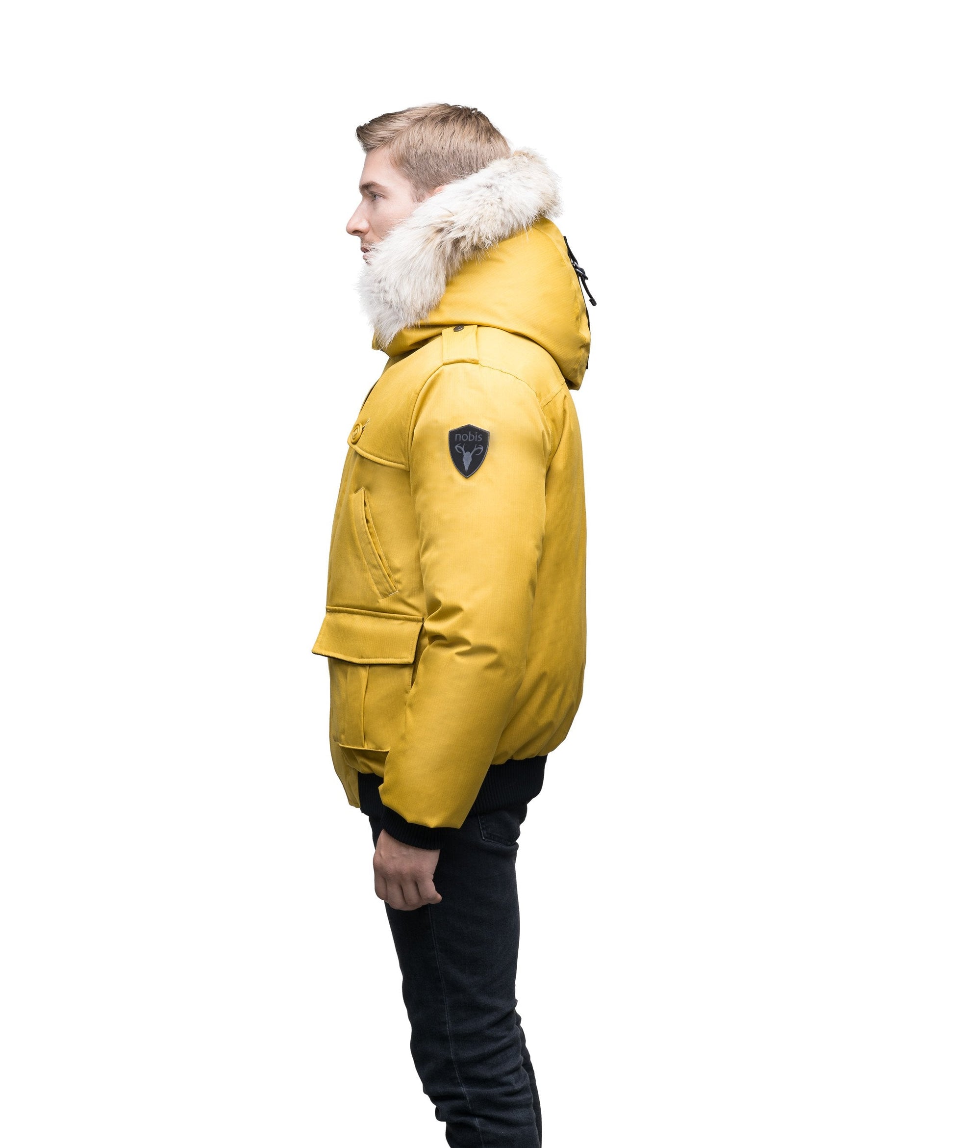 Men's down filled bomber that sits just above the hips with a completely removable hood that's windproof, waterproof, and breathable in CH Yellow