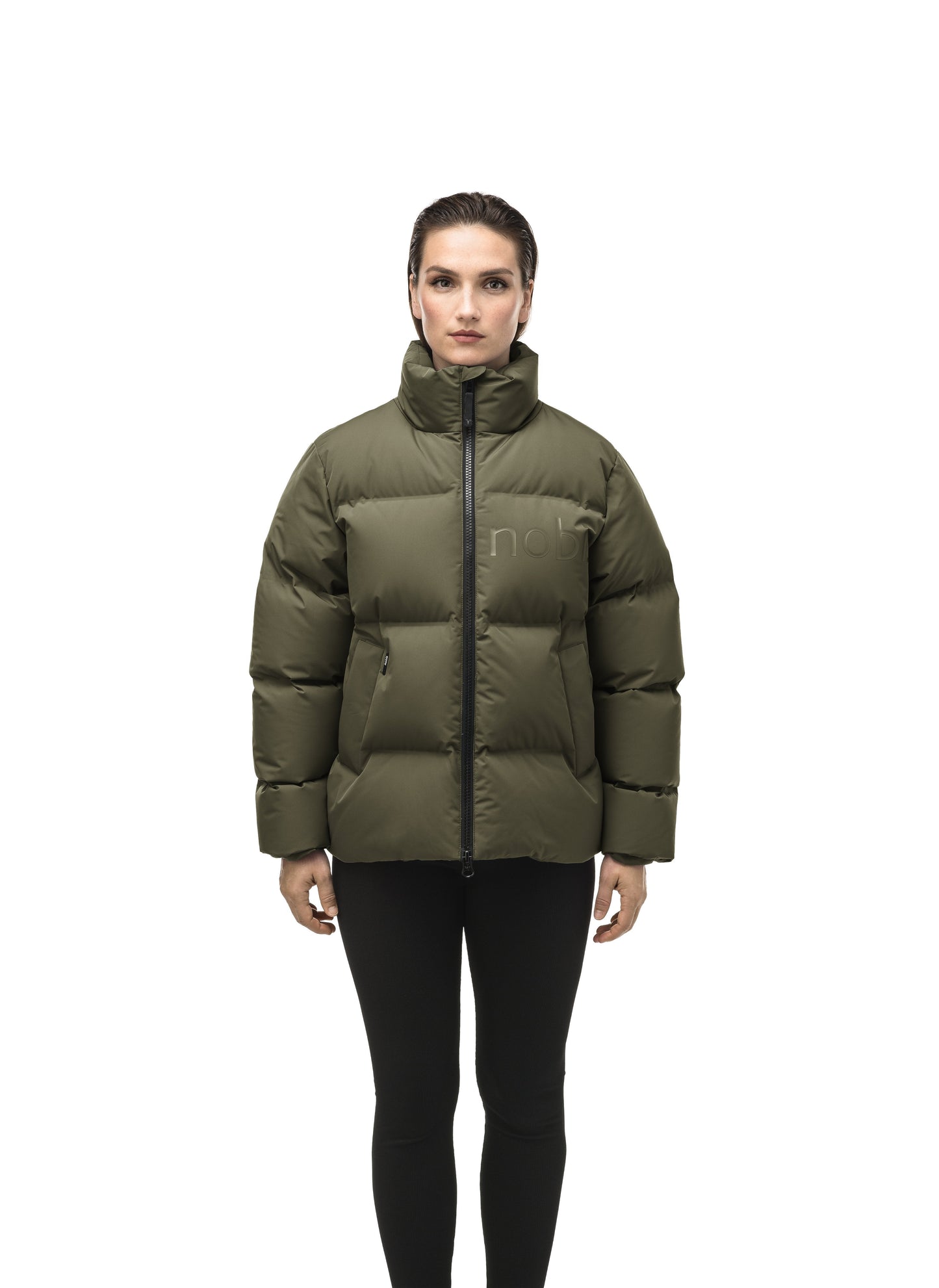 Women's puffer jacket with a minimalist modern design; featuring graphic details like oversized tonal branding, an exposed zipper, and seamless puffer channels to lock in the Premium Canadian Origin White Duck Down in Fatigue