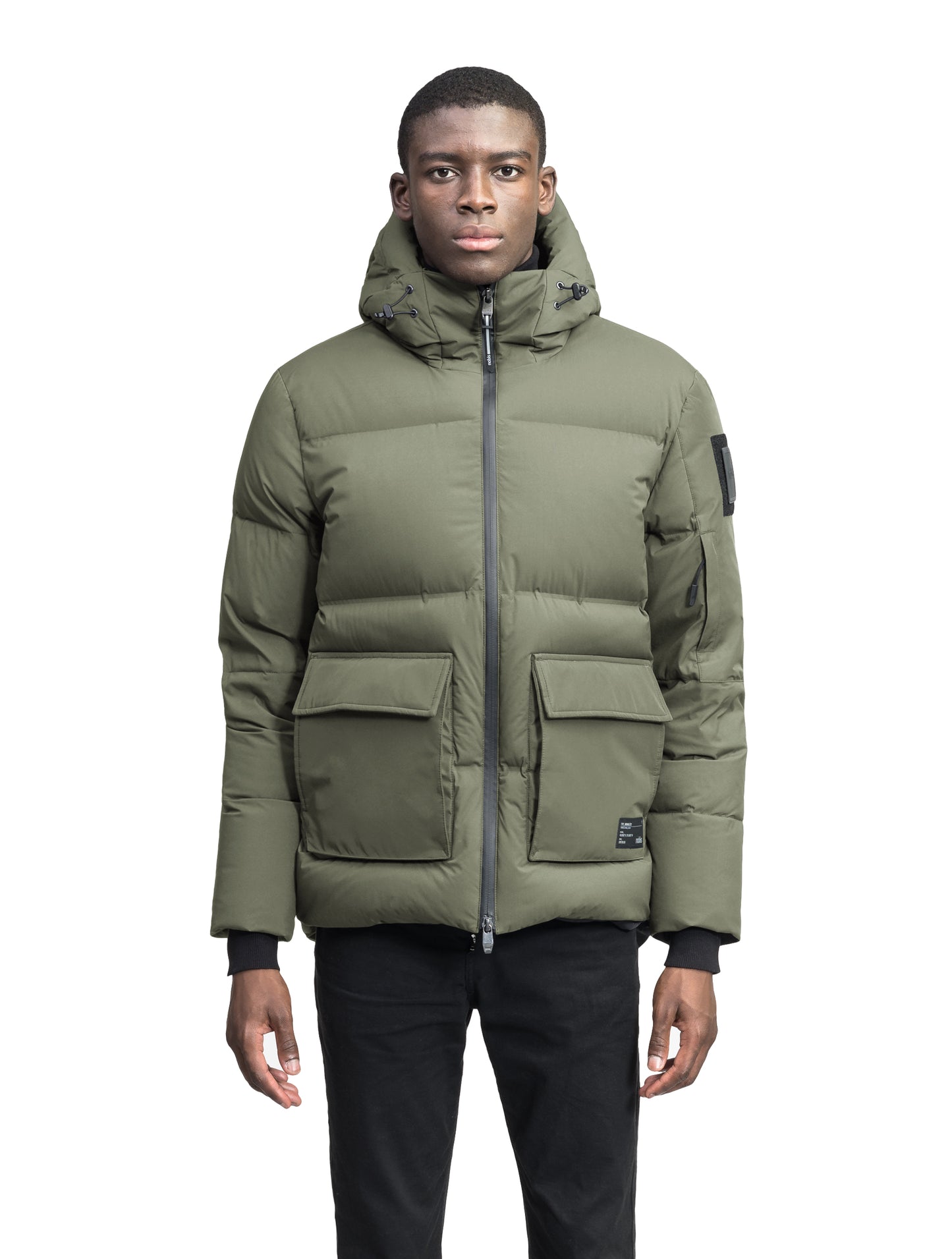 Supra Men's Performance Puffer in hip length, Technical Taffeta and 3-Ply Micro Denier fabrication, Premium Canadian White Duck Down insulation, non-removable down filled hood, centre front two-way zipper, flap pockets at waist, and zipper pocket at left bicep, in Clove